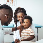 Mother and son talking with a doctor.