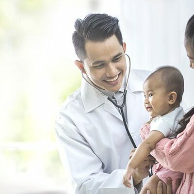 Mother and baby talking with doctor.